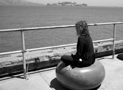 person sitting on the stone seat